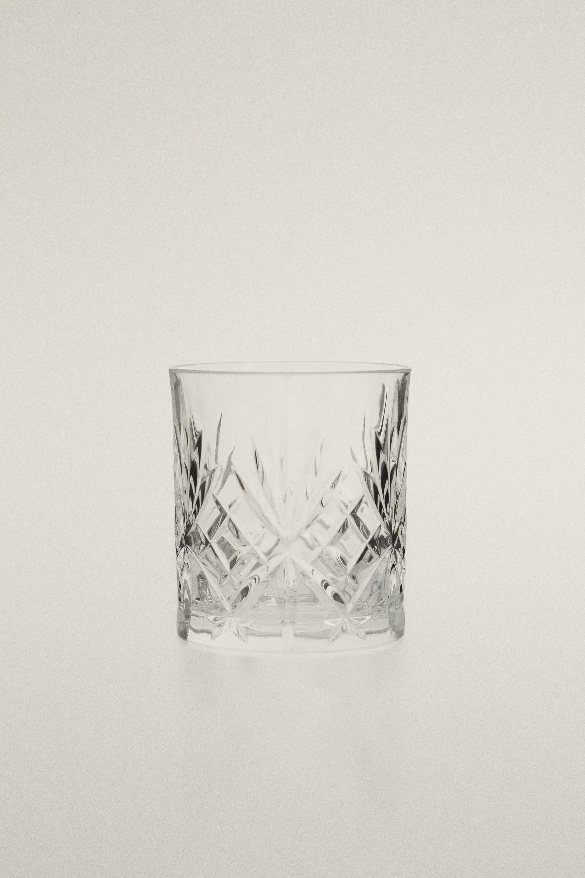 CRYSTALLINE TUMBLER WITH RAISED DESIGN